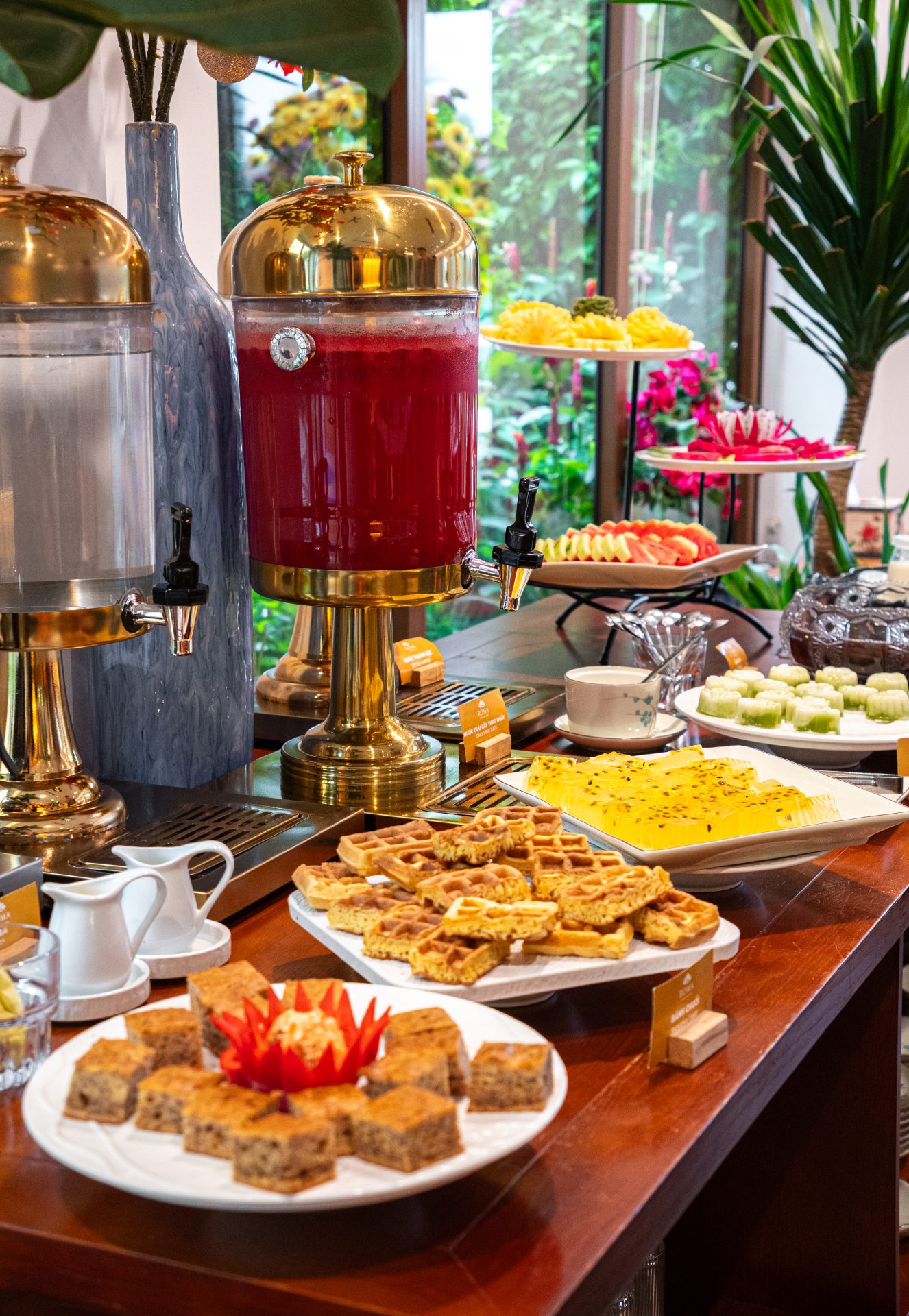 Breakfast buffet counter with hot dishes and pastries at a Skyeth Group hotel in Sunset Town Phu Quoc