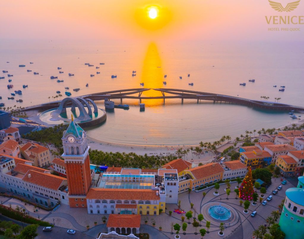 Kiss Bridge and the Sunset Town clock tower at sunset, Phu Quoc