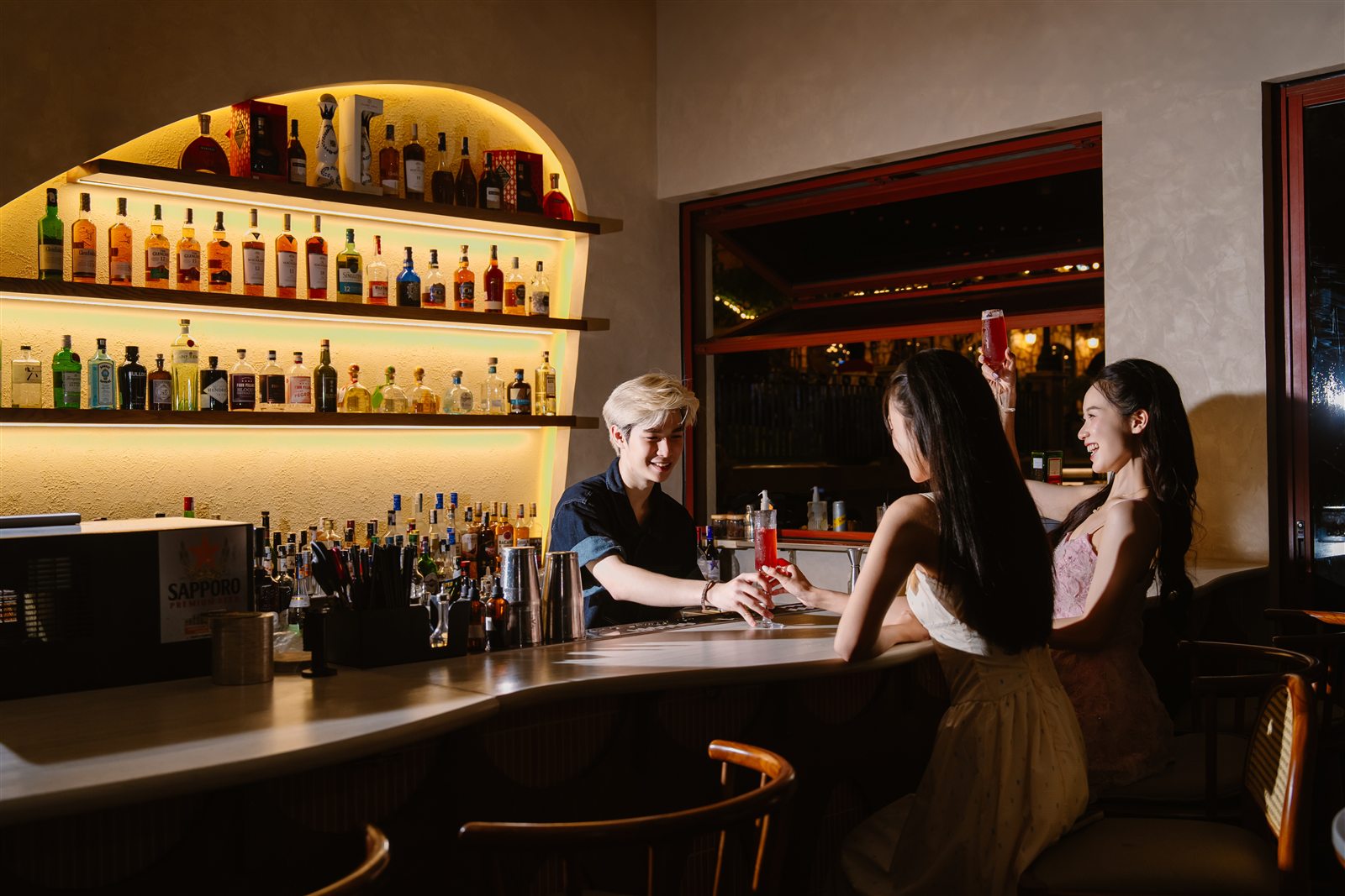 Indoor bar counter at Loop Jacuzzi Bar, Sunset Town late at night