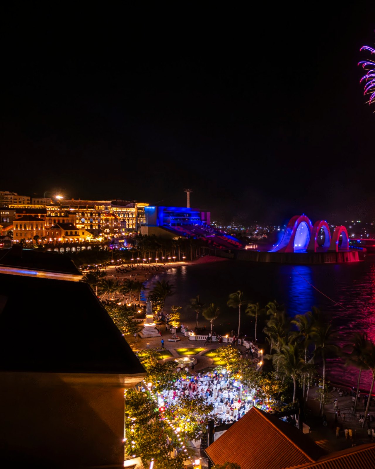 Fireworks beside Kiss Bridge, Sunset Town, seen from Venice Hotel