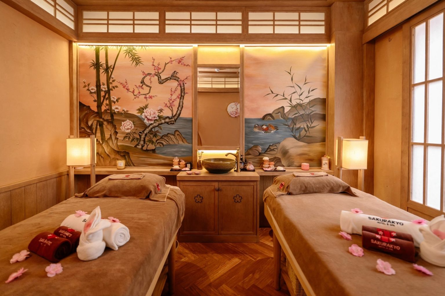 Treatment room with cherry blossom murals at Sakurakyo Spa
